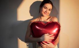 woman-holding-red-heart-shaped-balloon-self-love-celebrating-valentines-day