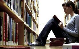 young-woman-reading-book-content-strategy-in-library