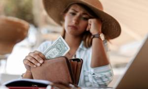 Woman Worried One Dollar Bill in Wallet Bankruptcy Signs Image for Bankruptcy Barometer - 5 Signs You Might Be Headed for Bankruptcy