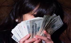 woman-holing-money-personal-finances