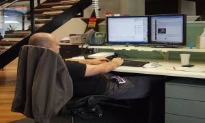 man-in-office-sitted-bad-posture-while-working