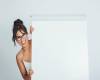 happy-businesswoman-hiding-whiteboard