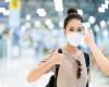 woman-wearing-covid-mask-airport-terminal