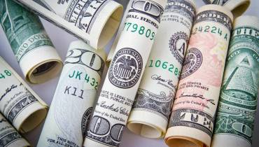 rolled-20-us-dollar-bills-financial-management-tips