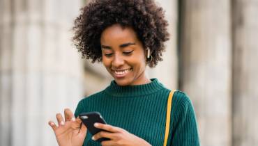 woman-using-mobile-phone-increae-app-downloads