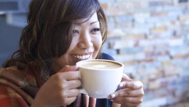 woman-smiley-sipping-classic-coffee