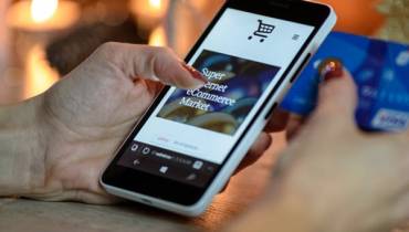 person-shopping-on-mobile-factors-influencing-online-shoppers