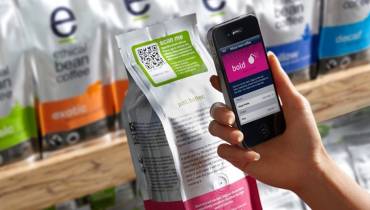hand smartphone scan QR code On packaging label