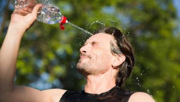 male-runner-drinking-splashing-water-his-face-refreshing-during-workout