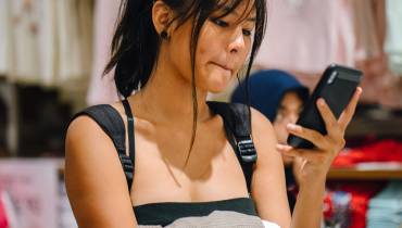 woman-checking-smartphone-internet-user-shopper