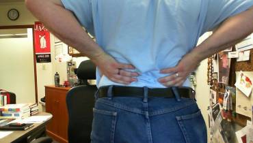 man-clutching-back-pain-sciatica