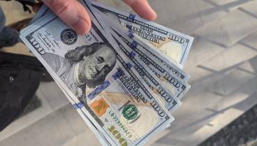 hand-holding-dollar-notes-improve-financial-health