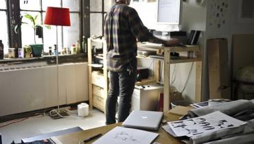 man-standing-while-working-at-home