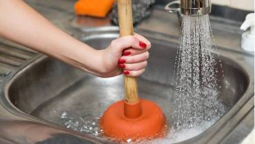woman-hand-pump-kitchen-sink