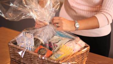 woman-wrapping-personalized-gift-hamper Image for Why More People Embrace the Uniqueness of Gifts Hampers 