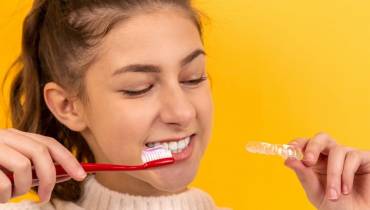 young-woman-brush-teath-oral-health