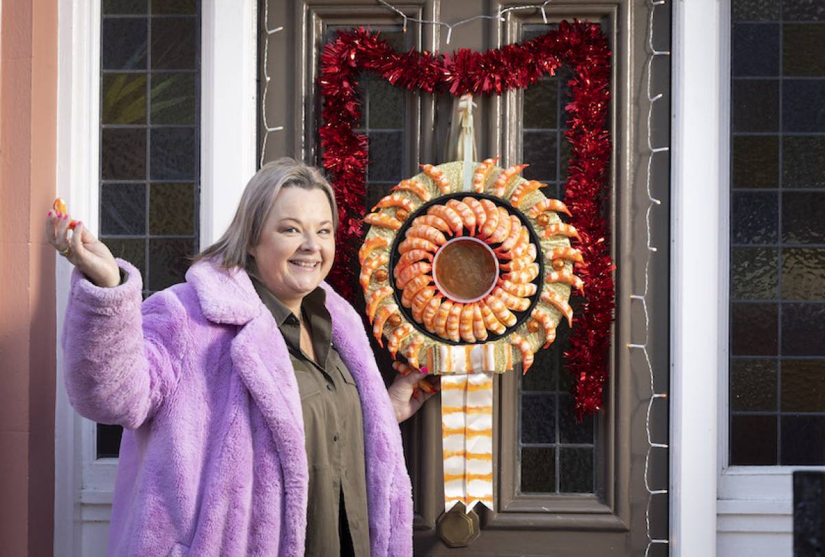 woman-smiling-iceland_prawn_ring_wreath-front-door