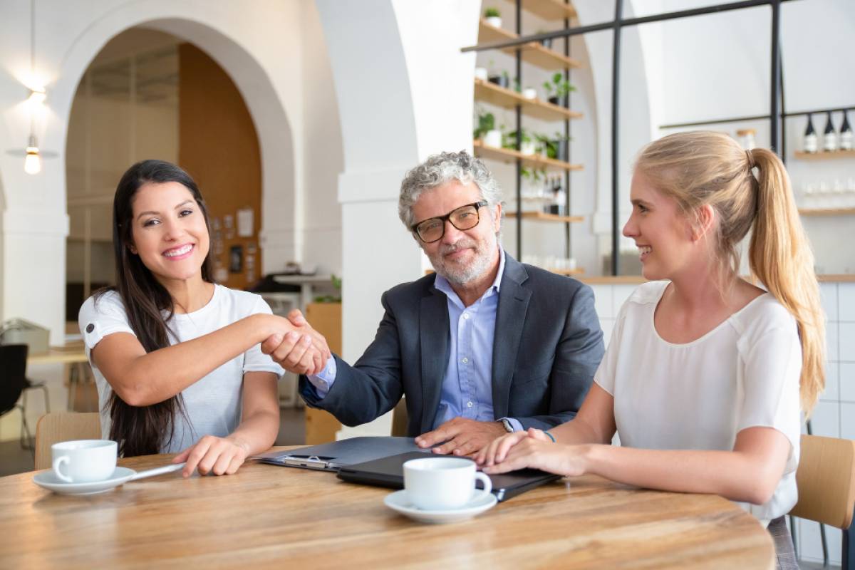 investor-shaking-hands-with-young-entrepreneurs