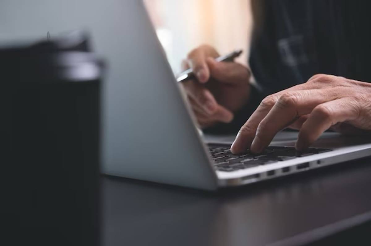 man hands typing on laptop computer web writing