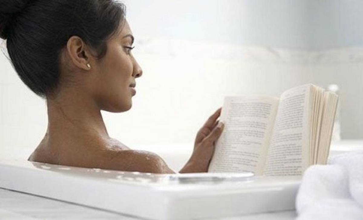 woman-in-bath-reading-book-provide-happiness-boost-as-big-vacations - illustration