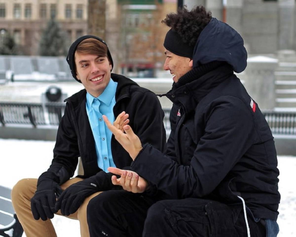 men-sitted-talking-outside-word-of-mouth-marketing