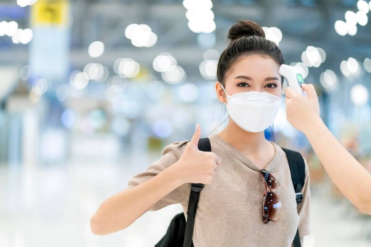 woman-wearing-covid-mask-airport-terminal