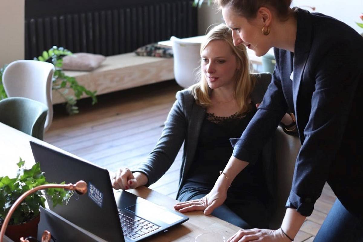 two-businesswomen-using-laptop-increase-business-growth