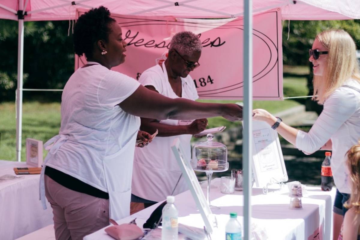 women-engage-visitors-at-exhibition-stand