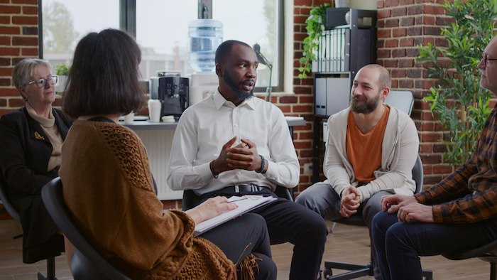 african-american-man-sharing-addiction-story-with-support-group-tmeeting-session30588.jpg