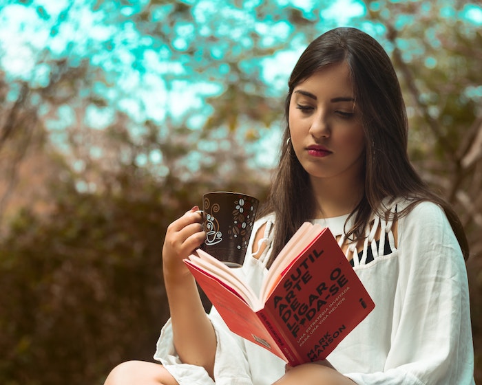 beautiful-teenage-girl-reading-outdoors.jpg