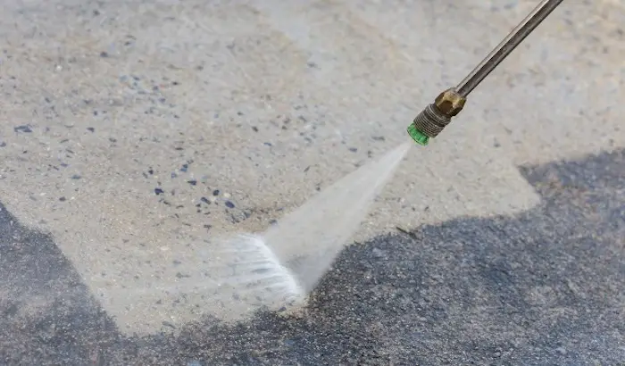cleaning-concrete-surface-hose-pipe-water-spray.jpg