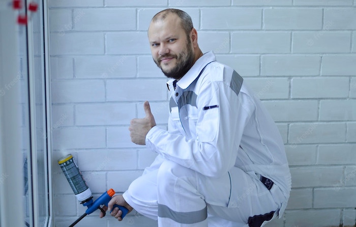 contractor-man-white-overalls-bathroom-remodeling.jpg