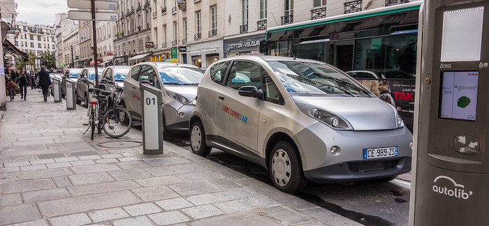 electric-cars-lined-up-city-downtown.jpg