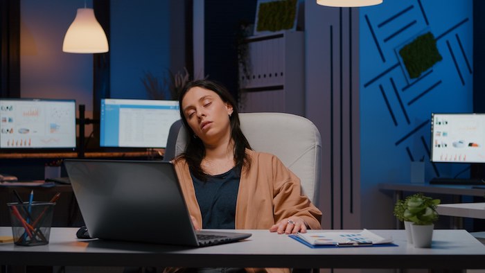 entrepreneur-woman-sleeping-front-laptop-while-working.jpg