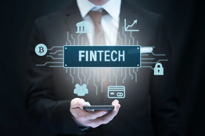 fintech_financial_technology_icon_over_smartphone_8b461bdfe0_b.jpg