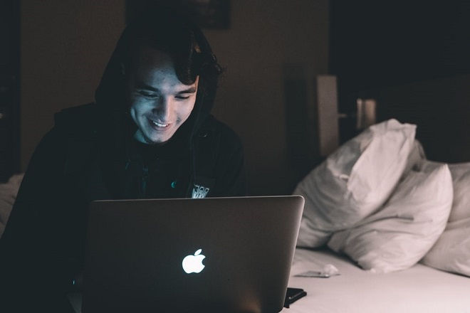 freelance-writer-smiling-dark-room-writing_business.jpg