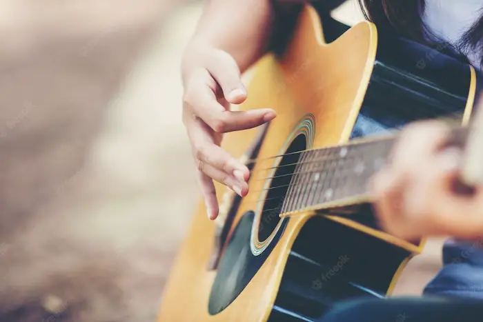 girl-playing-guitar-with-fingers.jpg