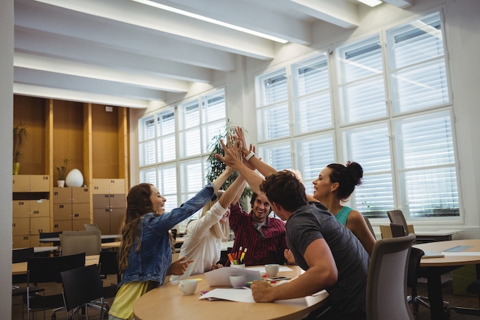 group-business-executives-giving-high-five.jpg