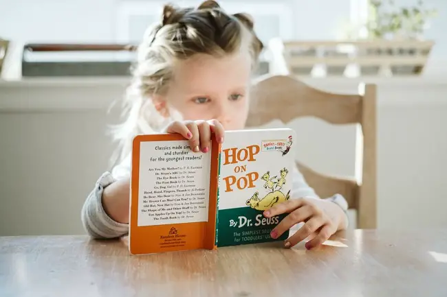 little-girl-reading-a-chosen-book.jpg