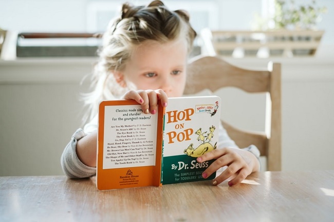 little-girl-reading-a-chosen-book.jpg