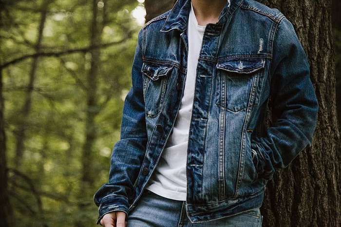 man-denim-jackets-leaning-on-tree-fashion.jpg