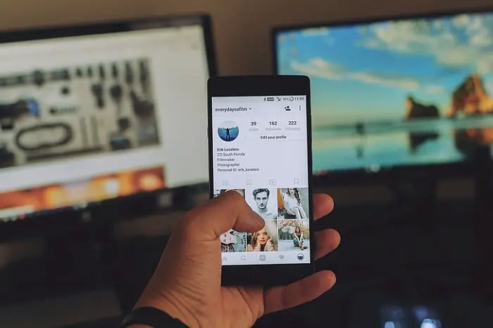 man-hand-holding-smartphone-instagram-screen-influencer-platforms.jpg