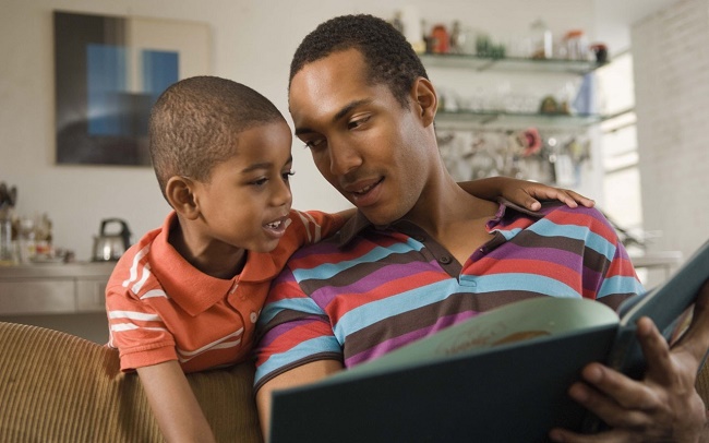 man-little-boy-with-open-book-making-time-to-read.jpg