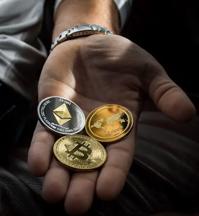 man-open-hand-crypto-coins