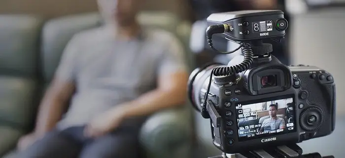 man-sitted-filmed-blured-video-shoot-camera-create-video-testimonial.jpg