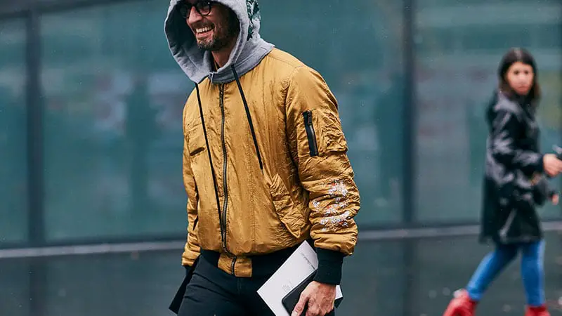 man-smiling-bomber-jacket-and-hoodie.jpg