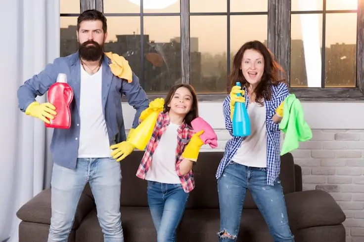 man-woman-child-daughter-family-holding-cleaning-supplies