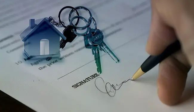 mans-hand-holding-pen-signing-real_estate-contrat-aggrement-business.jpg