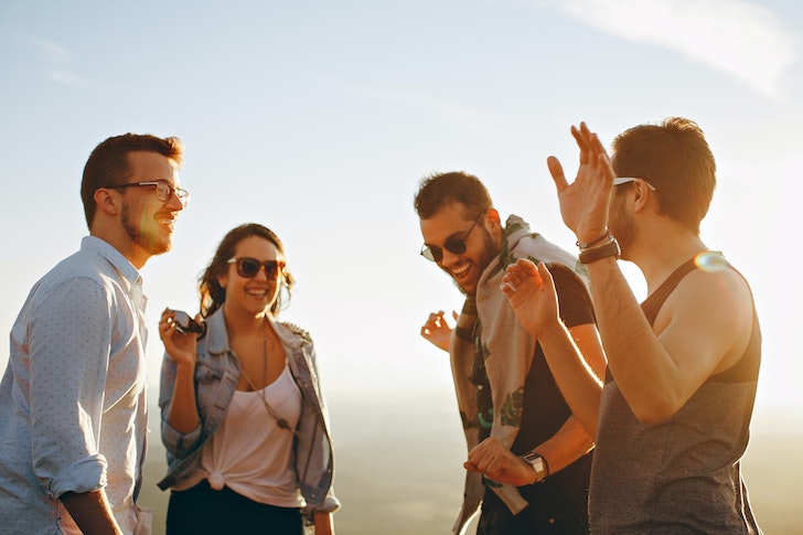 men-woman-friends-hanging-out-happy-laughing