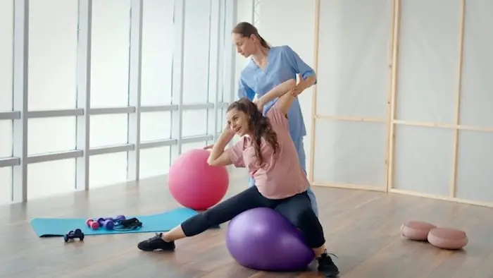 pregnant_woman_is_doing_exercises_with_a_health_worker